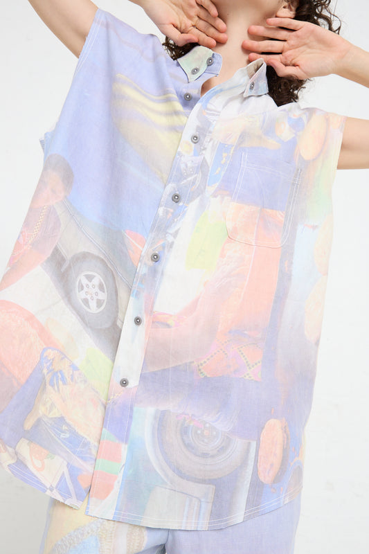 A woman wearing a Luna Del Pinal Hemp Sleeveless Shirt in Oversized Digital Market Print with an image of a car on it.
