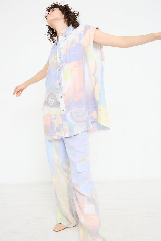 A woman wearing a Luna Del Pinal Hemp Sleeveless Shirt in Oversized Digital Market Print and pants.