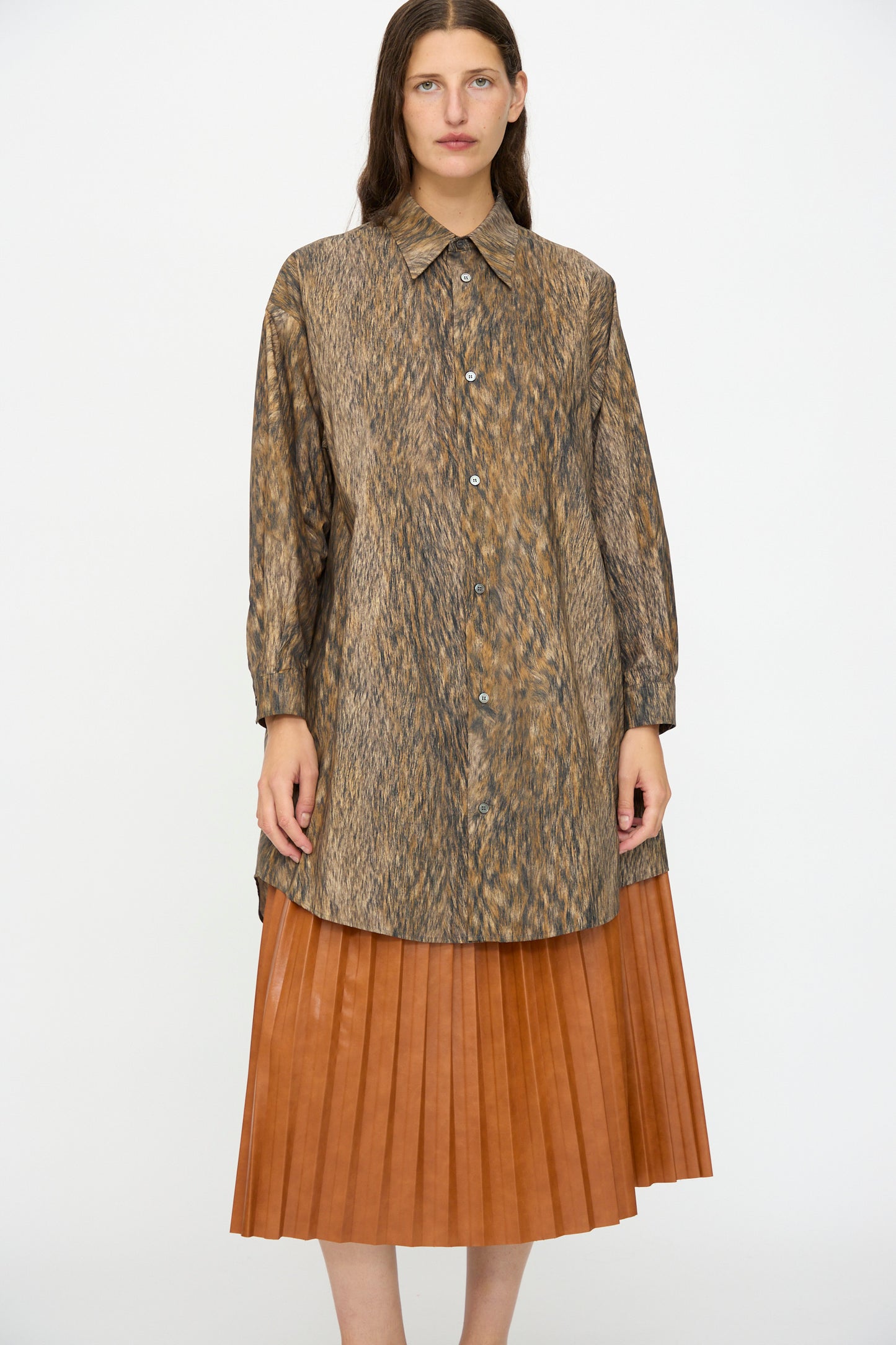 A woman faces forward in the MM6 Dress in Brown against a plain white background.