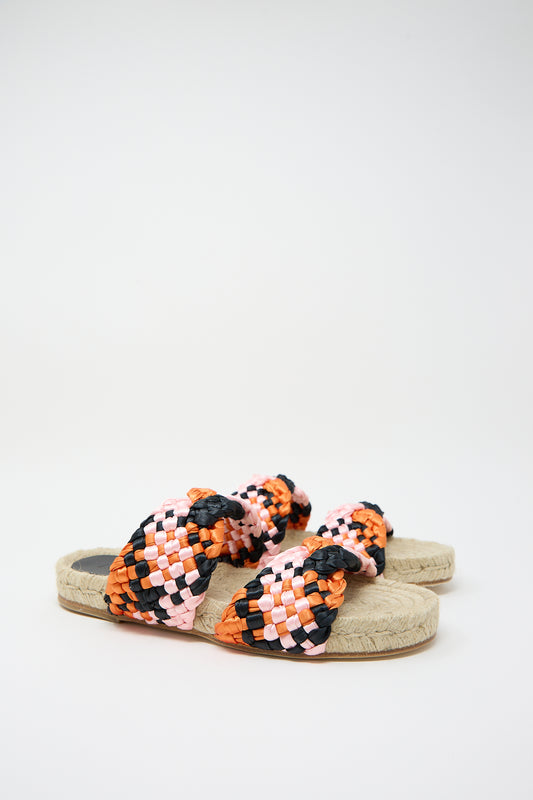 A pair of Marea's handmade multicolored braided satin espadrille sandals on a white background.