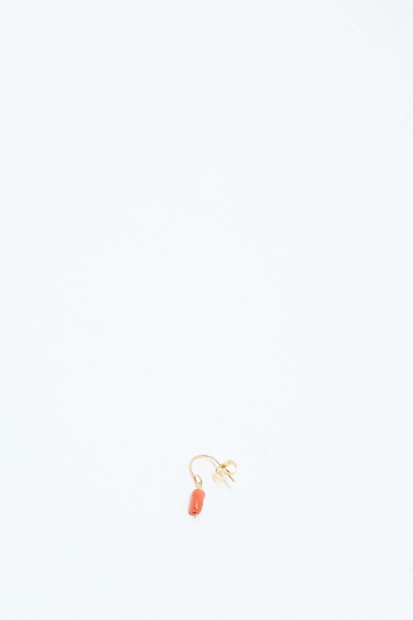The Mary MacGill 14K Crescent Charm Single Earring in Coral Pebbles is displayed on a plain white background.