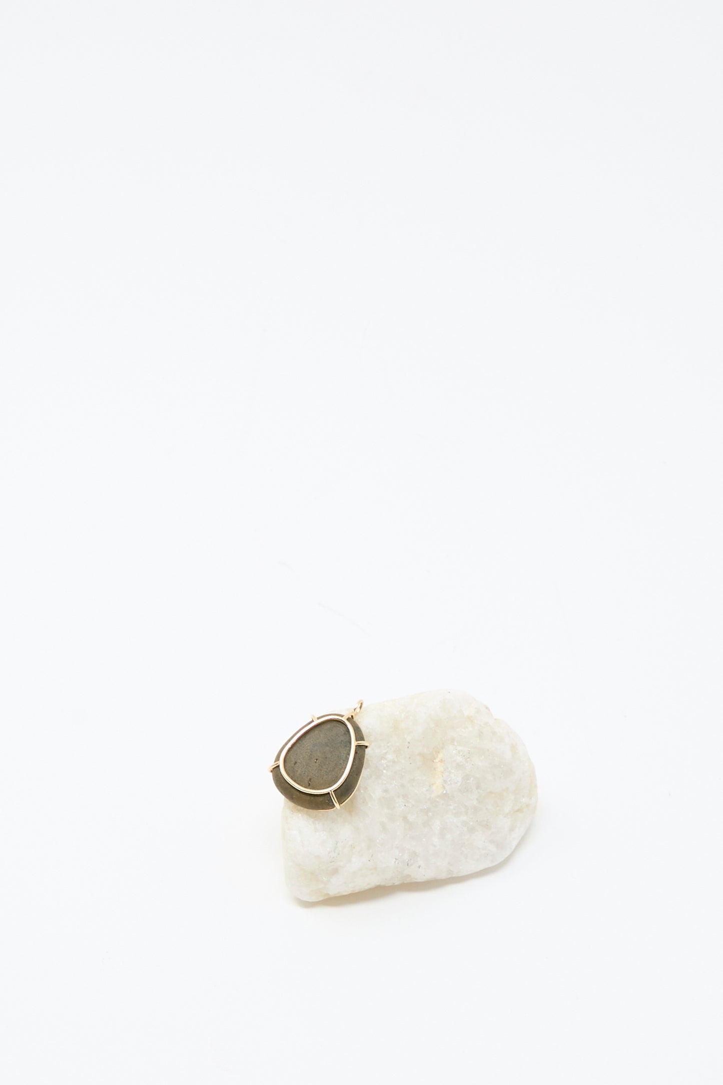 The Mary MacGill 14K Floating Pendant in Island Stone is shown on a white stone against a plain white background.