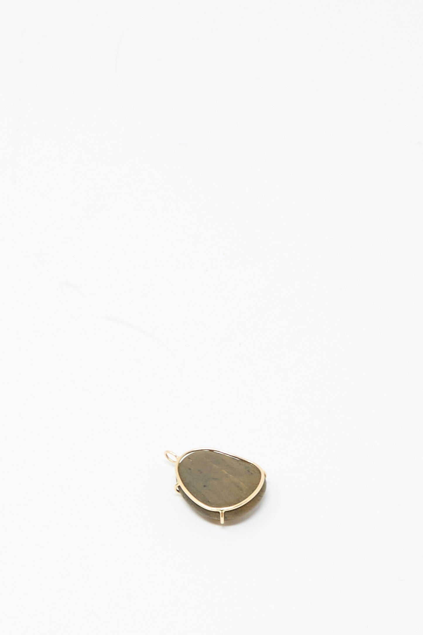 The Mary MacGill 14K Floating Pendant in Island Stone, with gold trim and an organic silhouette, is displayed on a plain white background to highlight its unique handmade charm.