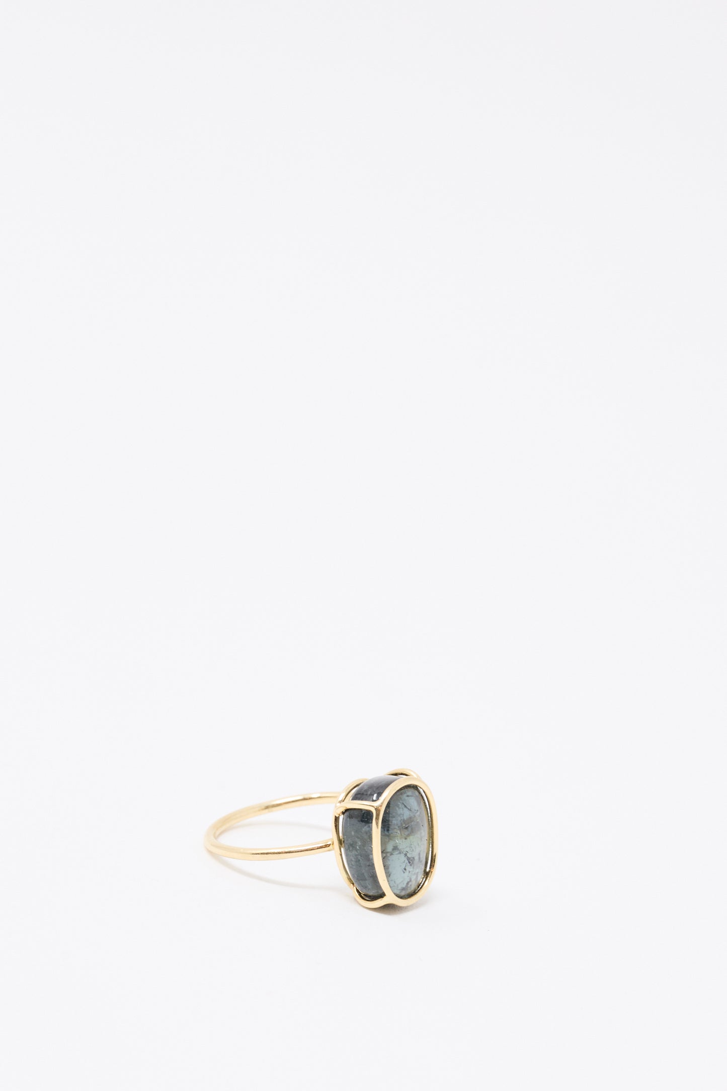 The Mary MacGill 14K Floating Ring features a large oval green tourmaline set vertically in handmade gold, shown against a plain white background.