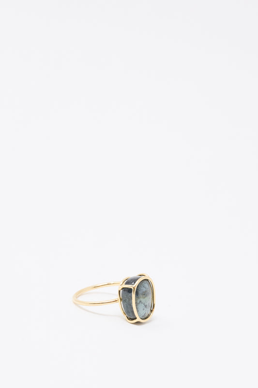 The Mary MacGill 14K Floating Ring features a large oval green tourmaline set vertically in handmade gold, shown against a plain white background.