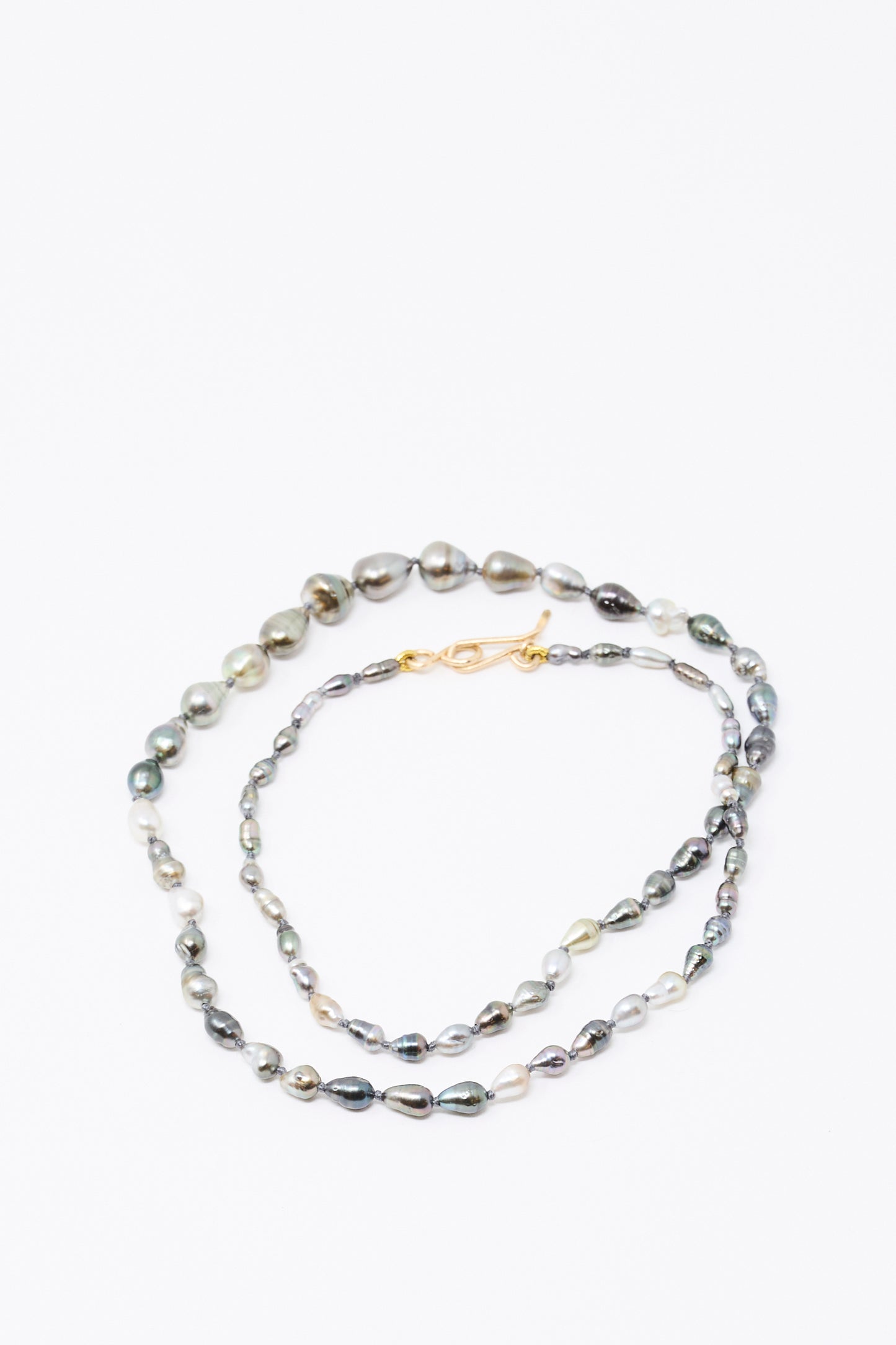 The Mary MacGill 14K Stone Layering Necklace in Keshi Pearl features irregular grey and silver pearls with a 14k gold clasp, displayed on a white background.