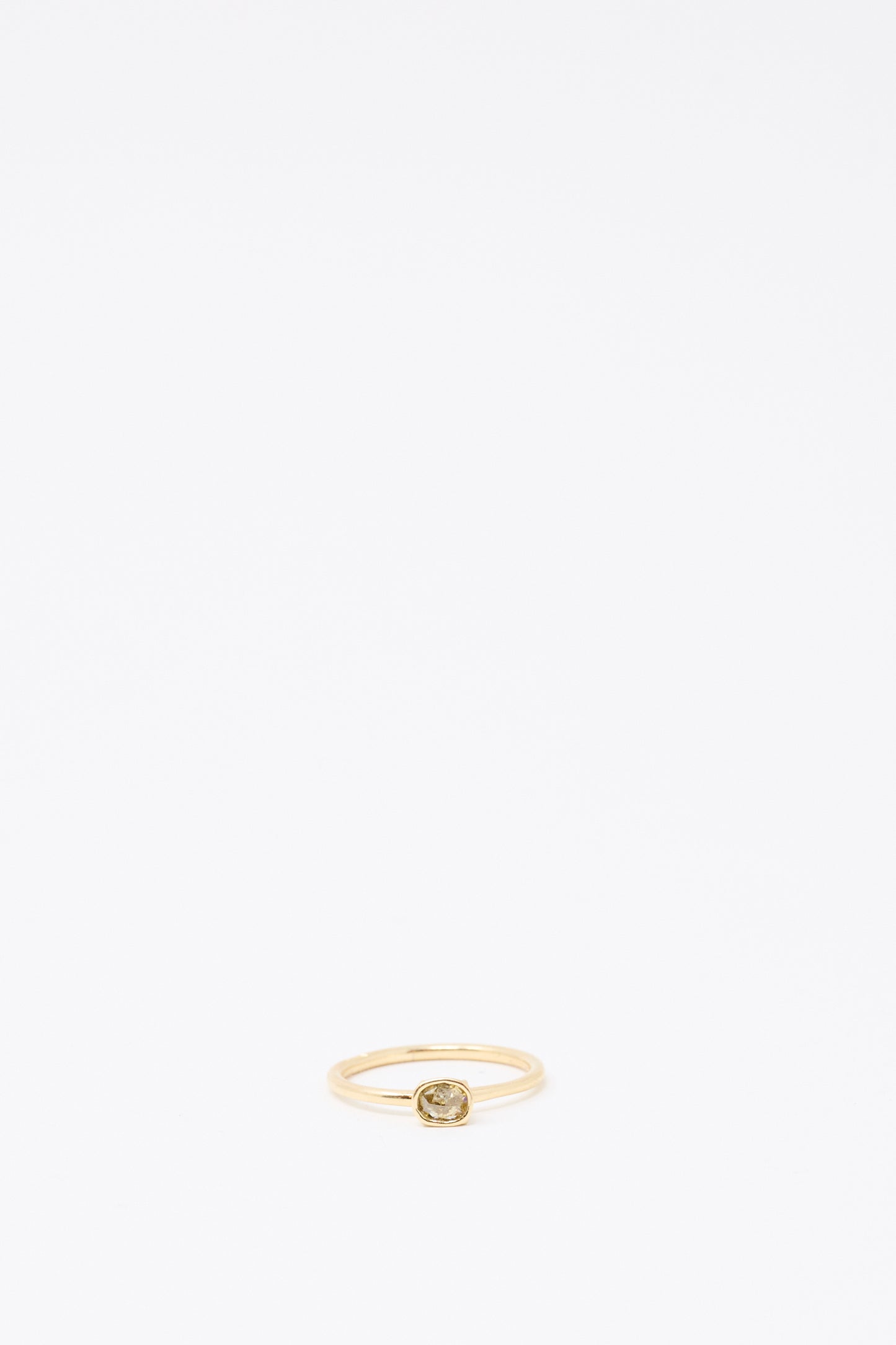 The Mary MacGill 14K Floating Ring features a round cognac rose cut mineral diamond, set in gold and displayed on a plain white background to highlight its handmade craftsmanship.