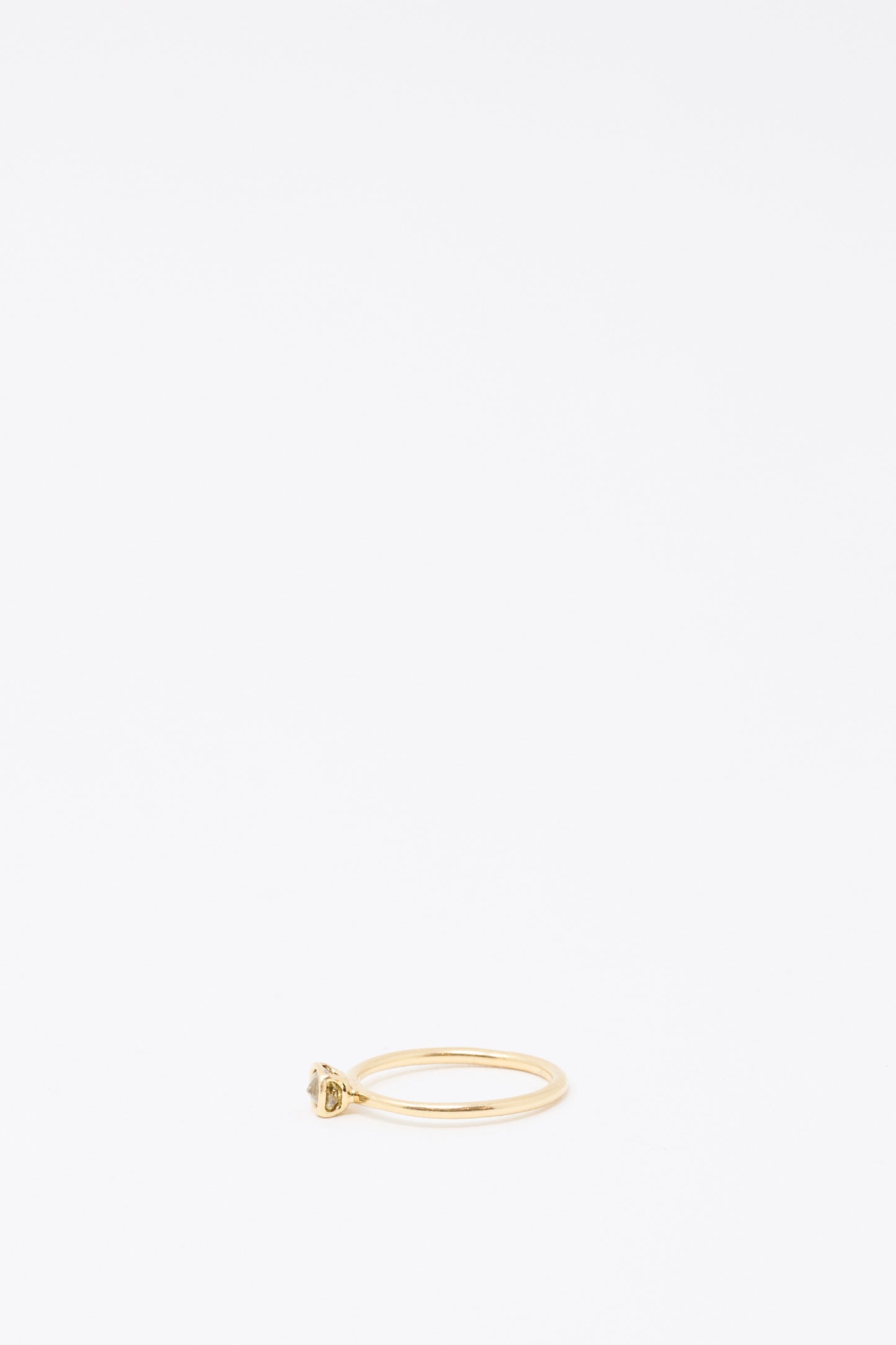 Mary MacGill's 14K Floating Ring features a small Cognac Rose Cut Mineral Diamond set atop a thin handmade gold band, shown on a plain white background.