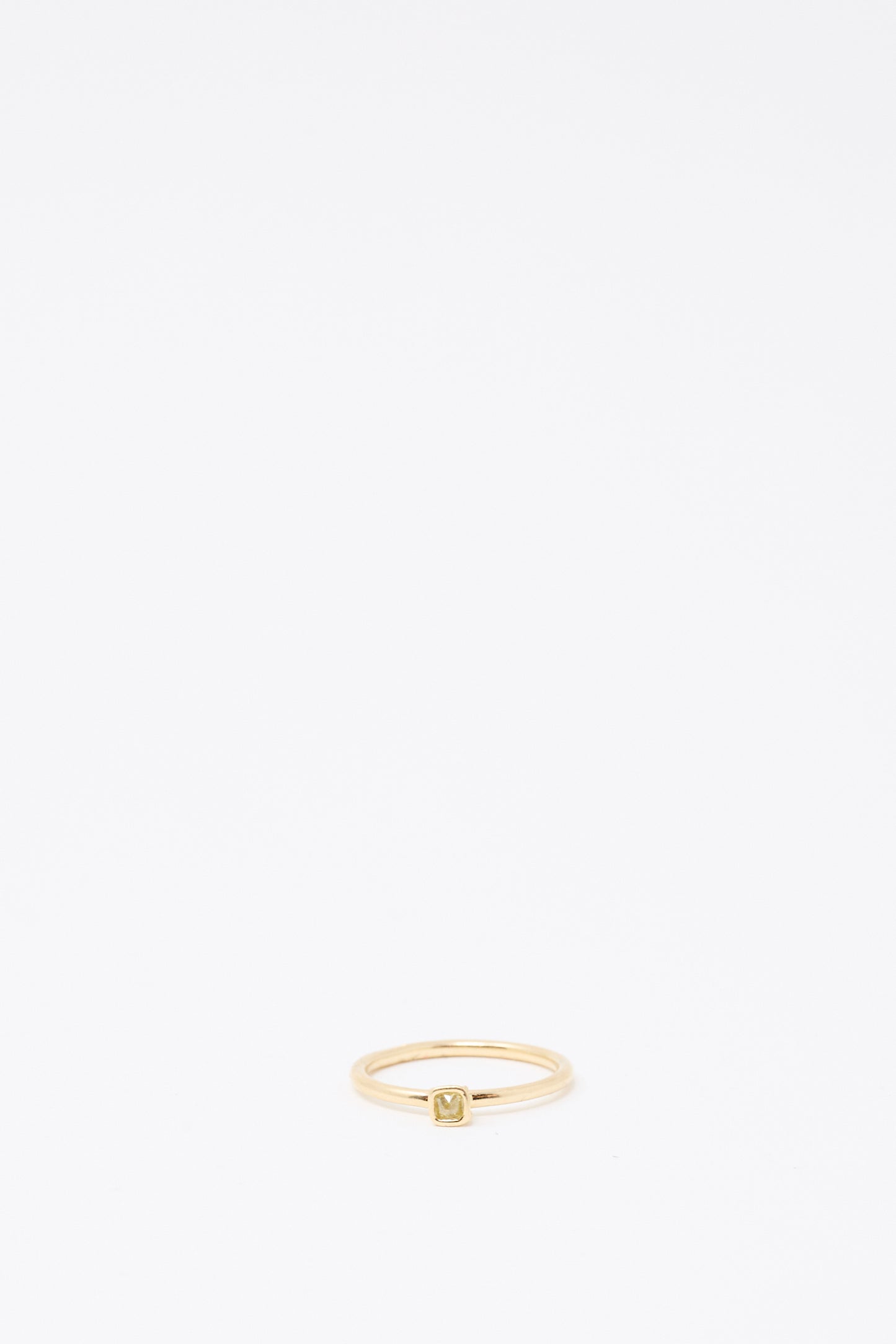 The Mary MacGill 14K Floating Ring features a petite, light green rose cut mineral diamond in a square setting, shown against a white background.