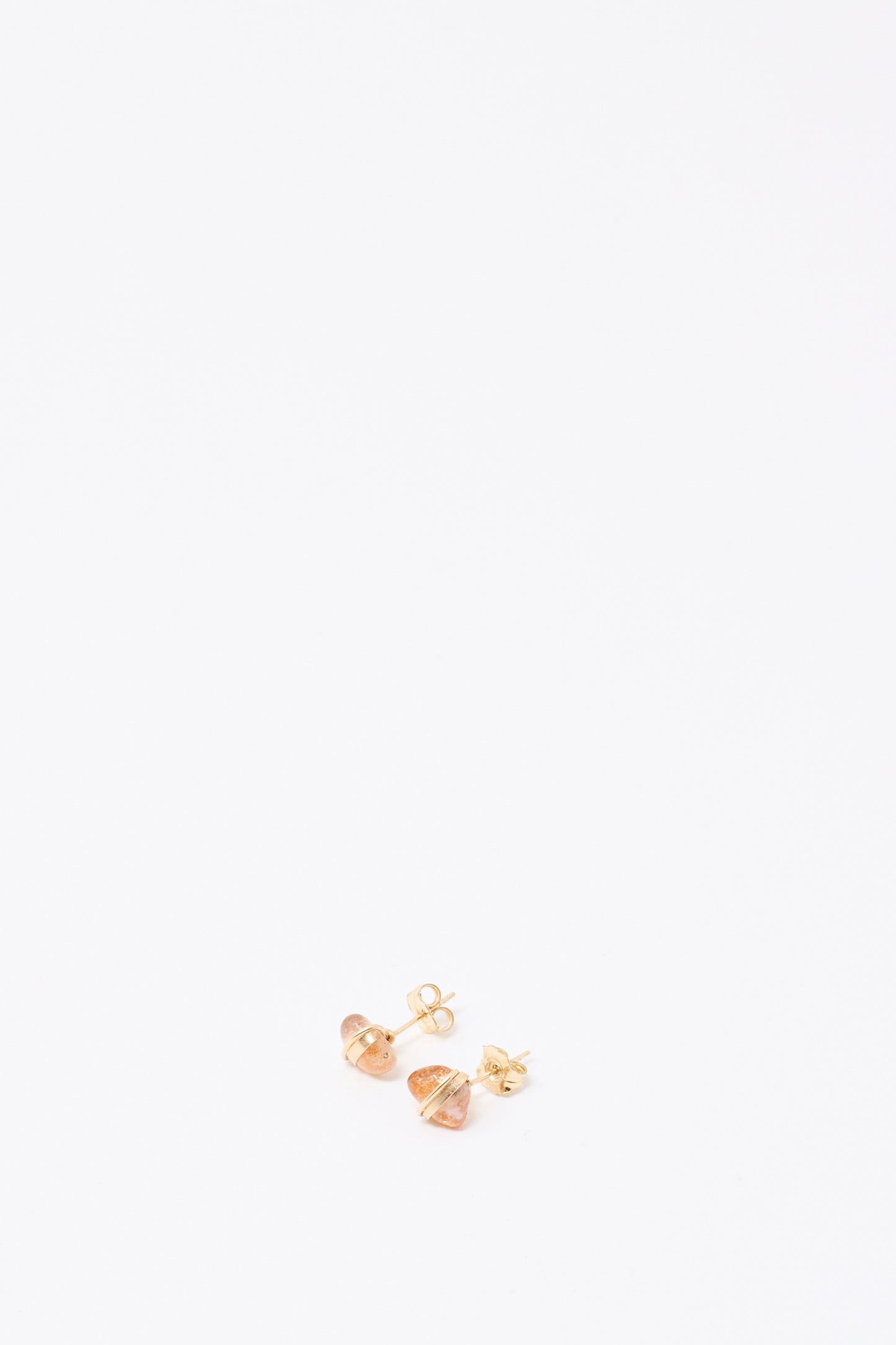 A pair of Mary MacGill Stone Studs in Sunstone with a geometric design is displayed on a plain white background.