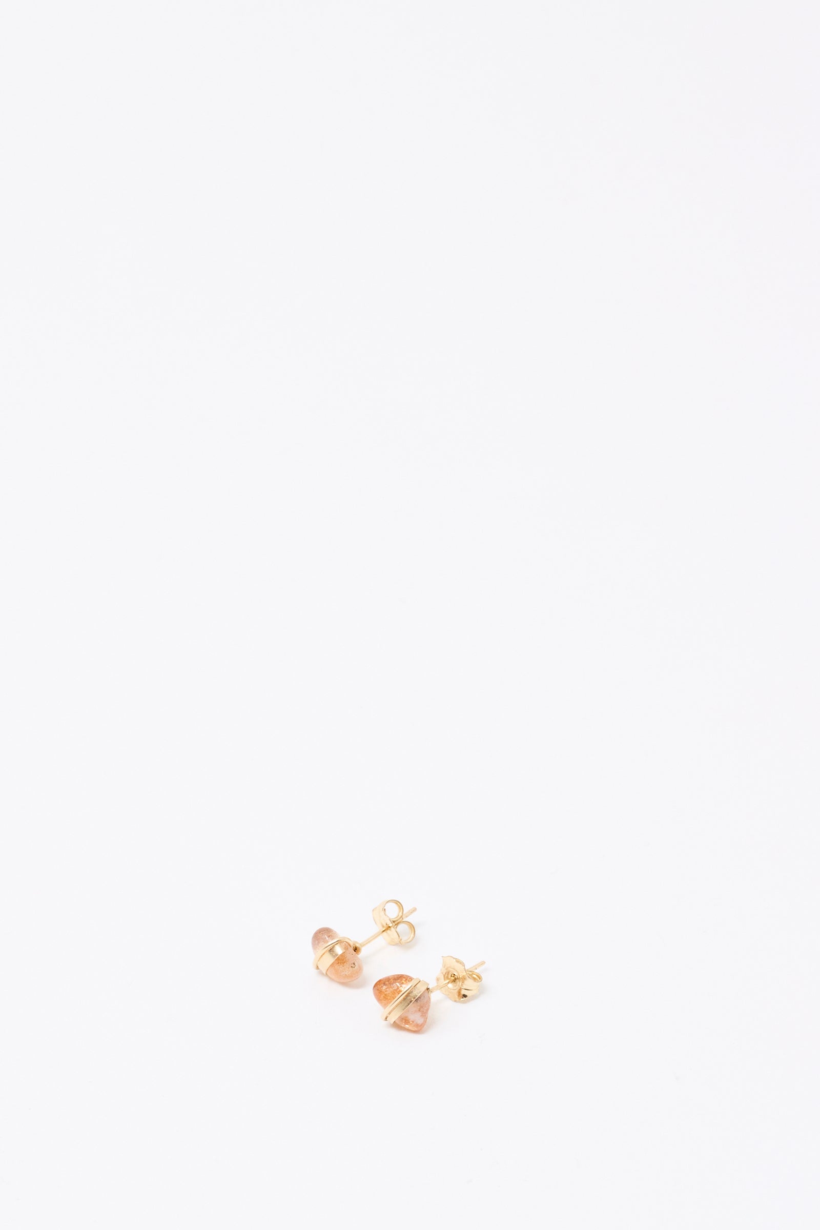 A pair of Mary MacGill Stone Studs in Sunstone with a geometric design is displayed on a plain white background.