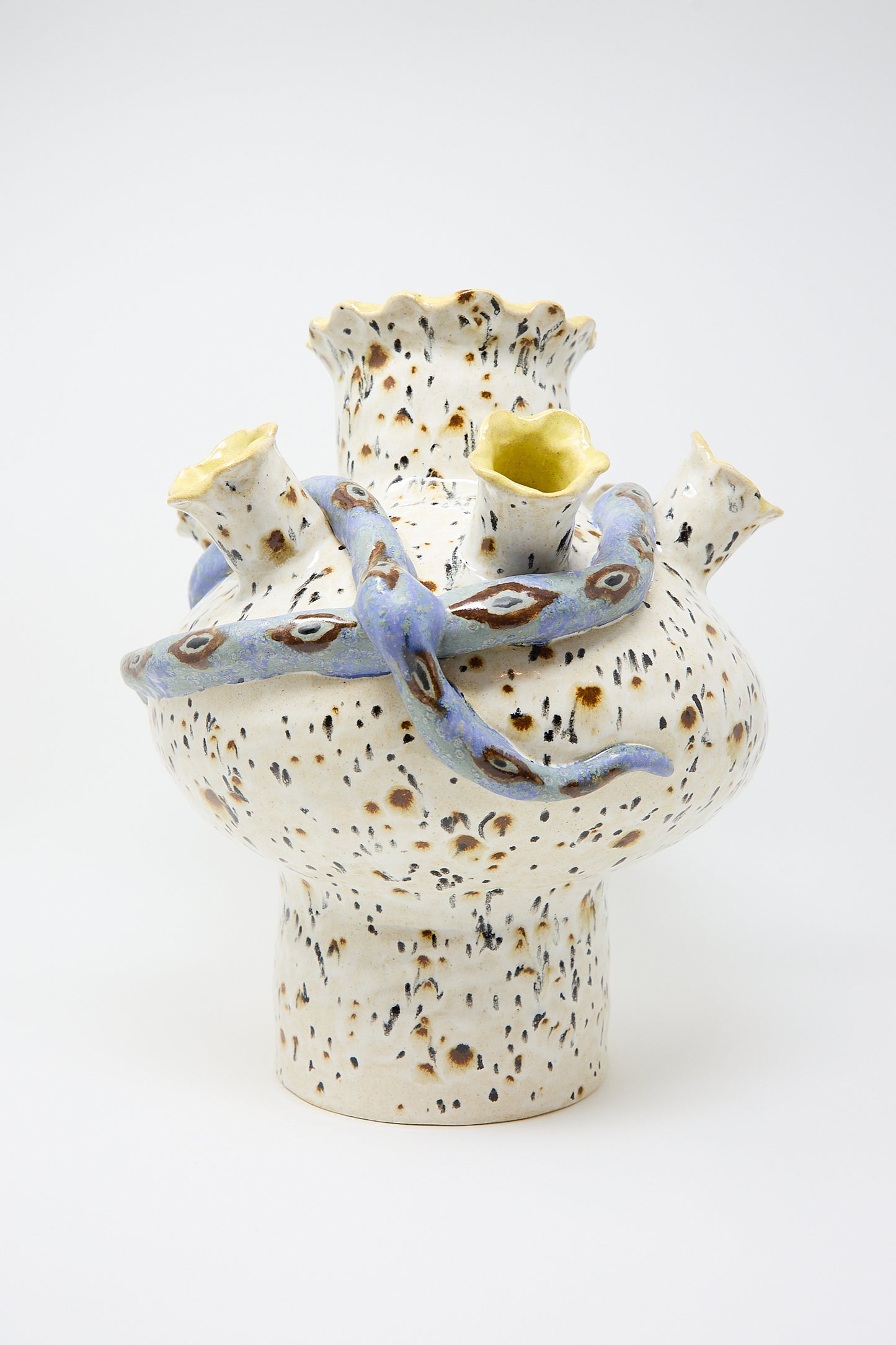 A Snake Tulipiere by Pearce Williams featuring abstract speckled design with multiple protruding, irregular openings, some adorned with blue glaze.