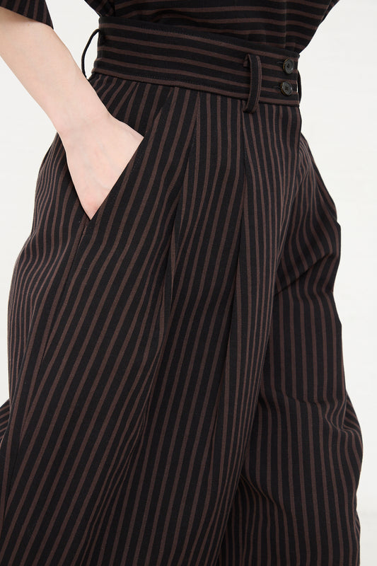 Close-up of a person wearing Rachel Comey Melio Short in Black with a hand in pocket.