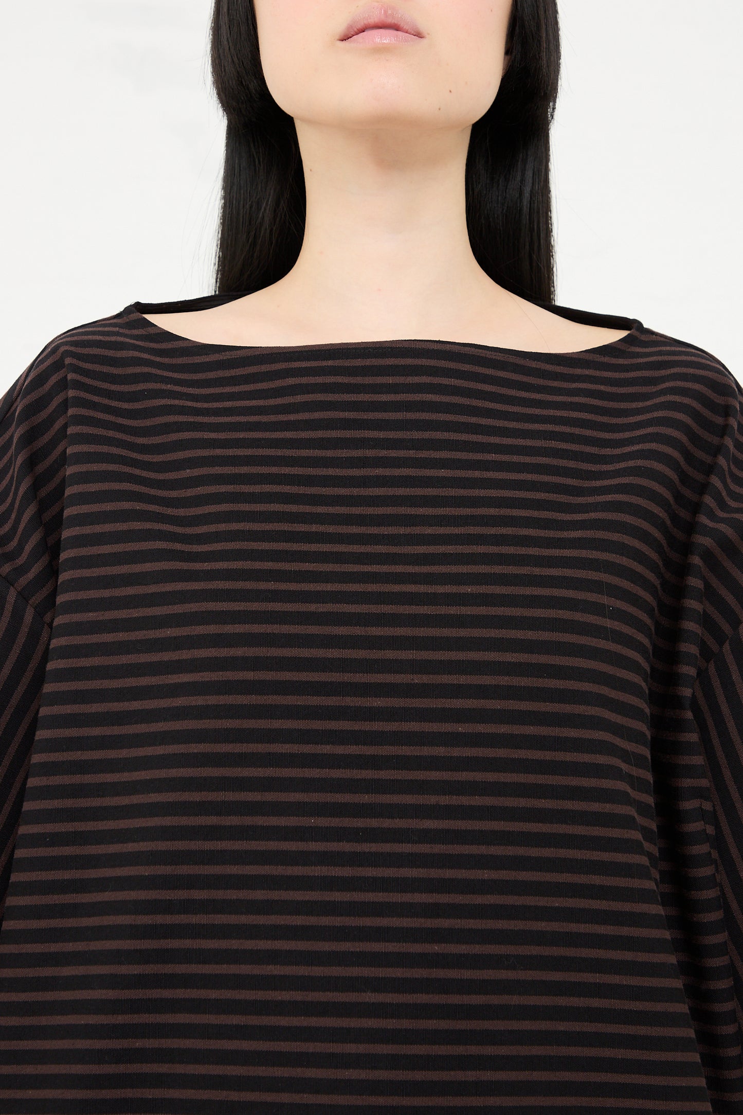 Woman wearing a Rachel Comey Ode Top in Black, cropped at the neck.