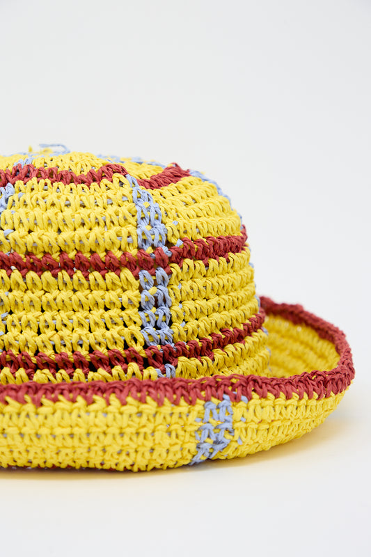 Handmade crocheted Artista Paper Unci Hat in Yellow Lines by Reinhard Plank on a plain white background.