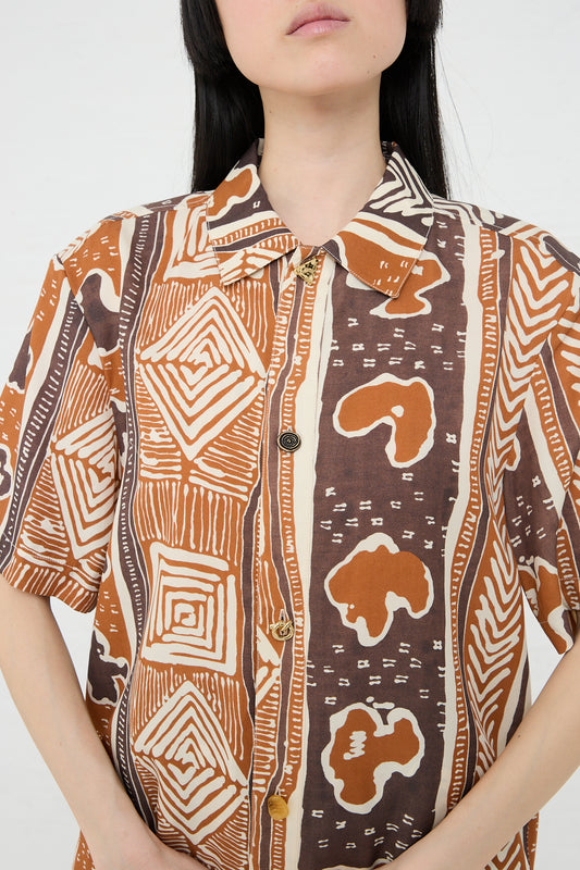 Woman wearing a Rejina Pyo Marty Shirt in Print Brown with vintage-inspired, hand-painted geometric and abstract designs.