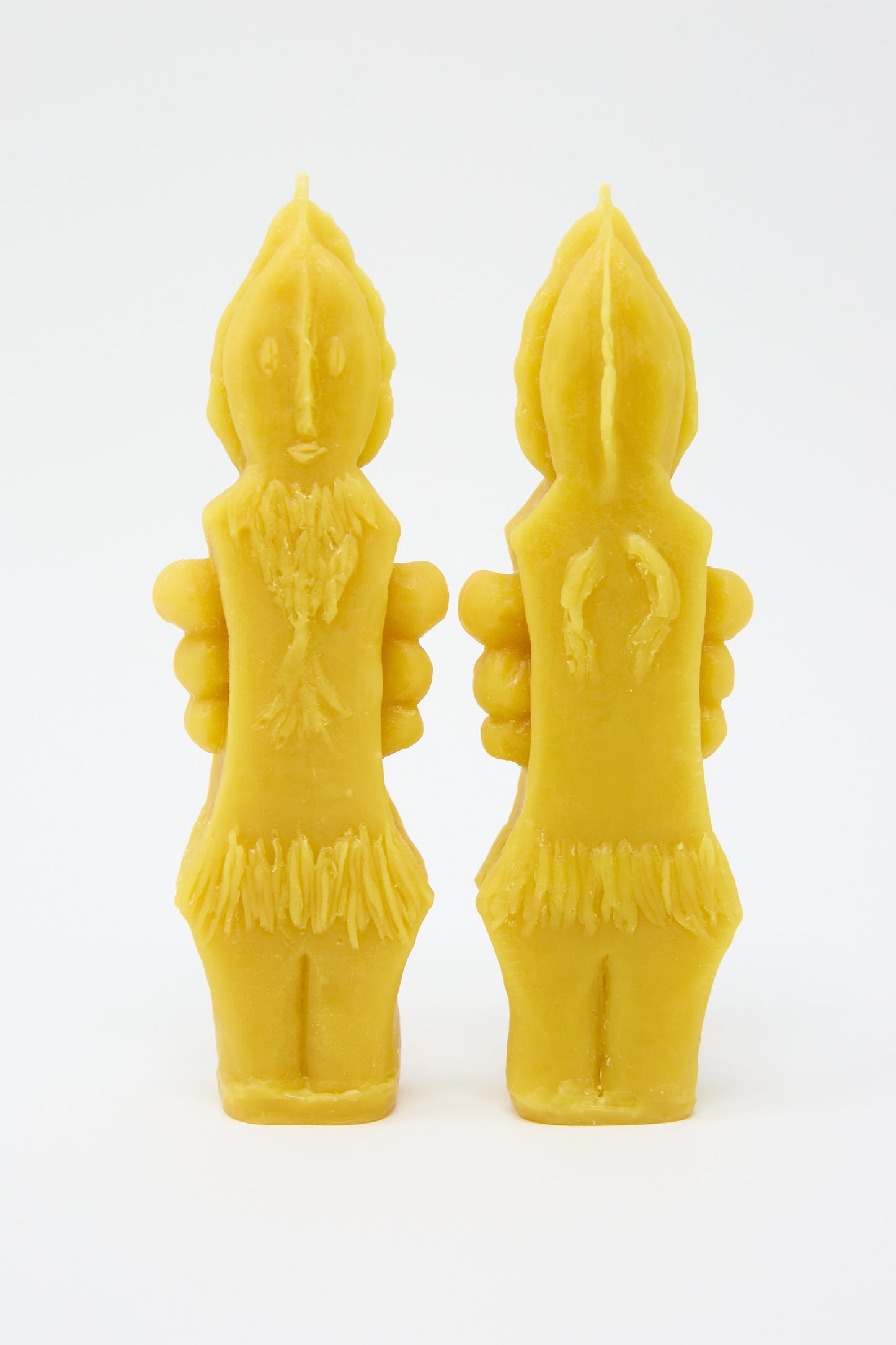 Two Plant Goddess Candles shaped like human figures, standing upright on a white background, made by hand in Kyoto by Rinn to Hitsuji.