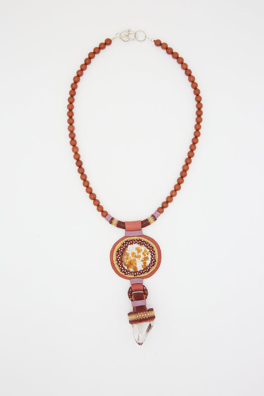 Double Stone Necklace with Red Jasper Beads by Robin Mollicone, with a central pendant featuring a circular design and a hanging fire opal.