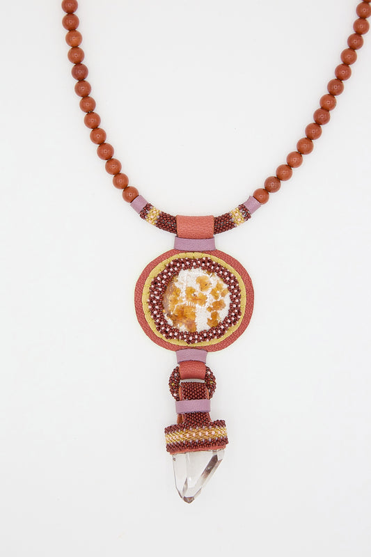Handcrafted Double Stone Necklace with Red Jasper Beads and a pendant featuring crystal, fire opal, and beadwork on a white background by Robin Mollicone.