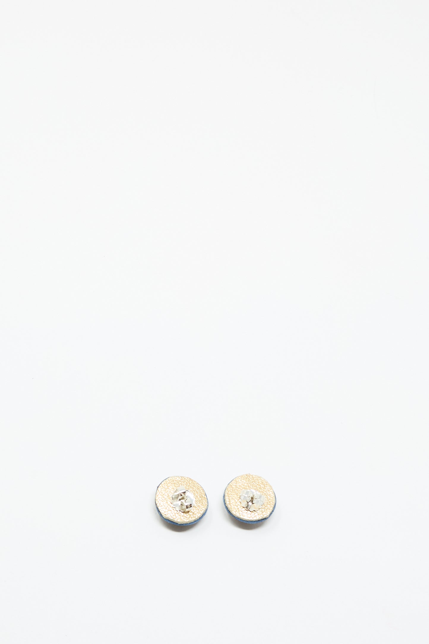 A pair of small, round Robin Mollicone Stud Earrings in Blue with Azurite, featuring a clear central gemstone, shown against a plain white background.