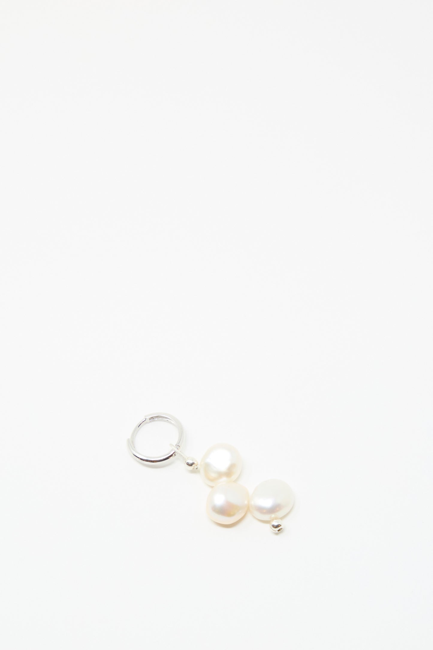 The Baba Earring in Triple Baby by Santangelo features sterling silver hoops with two lustrous freshwater keshi pearls, elegantly showcased against a plain white background.