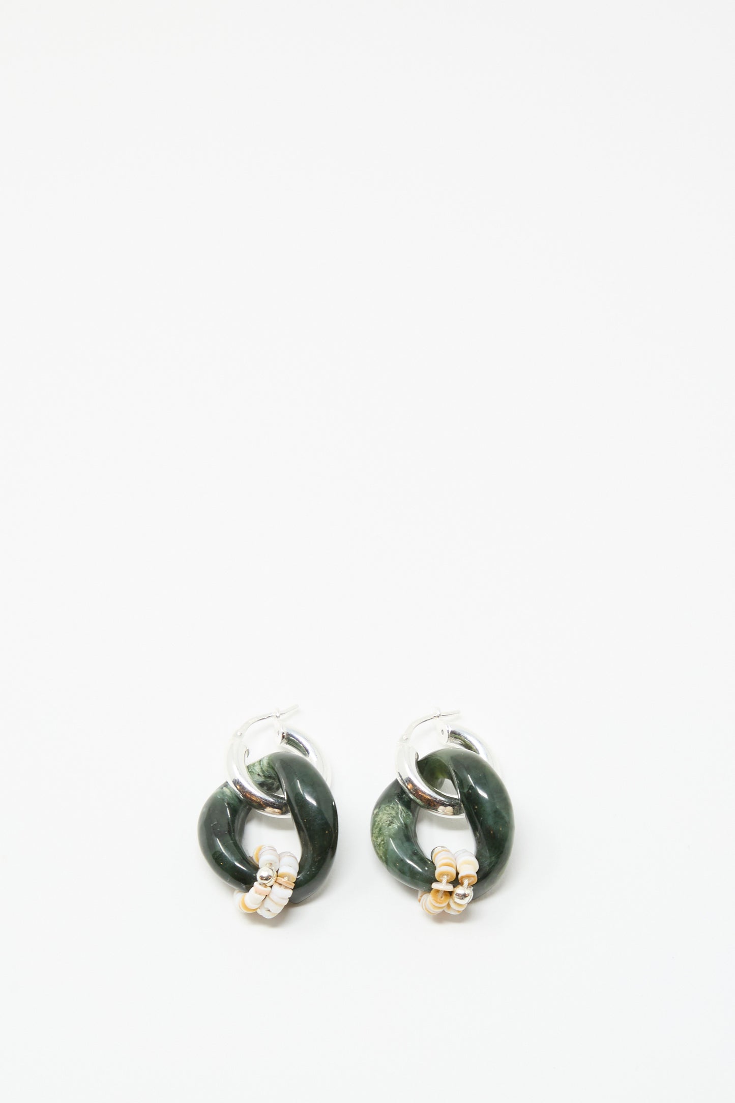 The Santangelo Bad Orb Earrings in Jade are sterling silver hoops with dark green twisted loops, silver and gold accents, showcased on a plain white background.