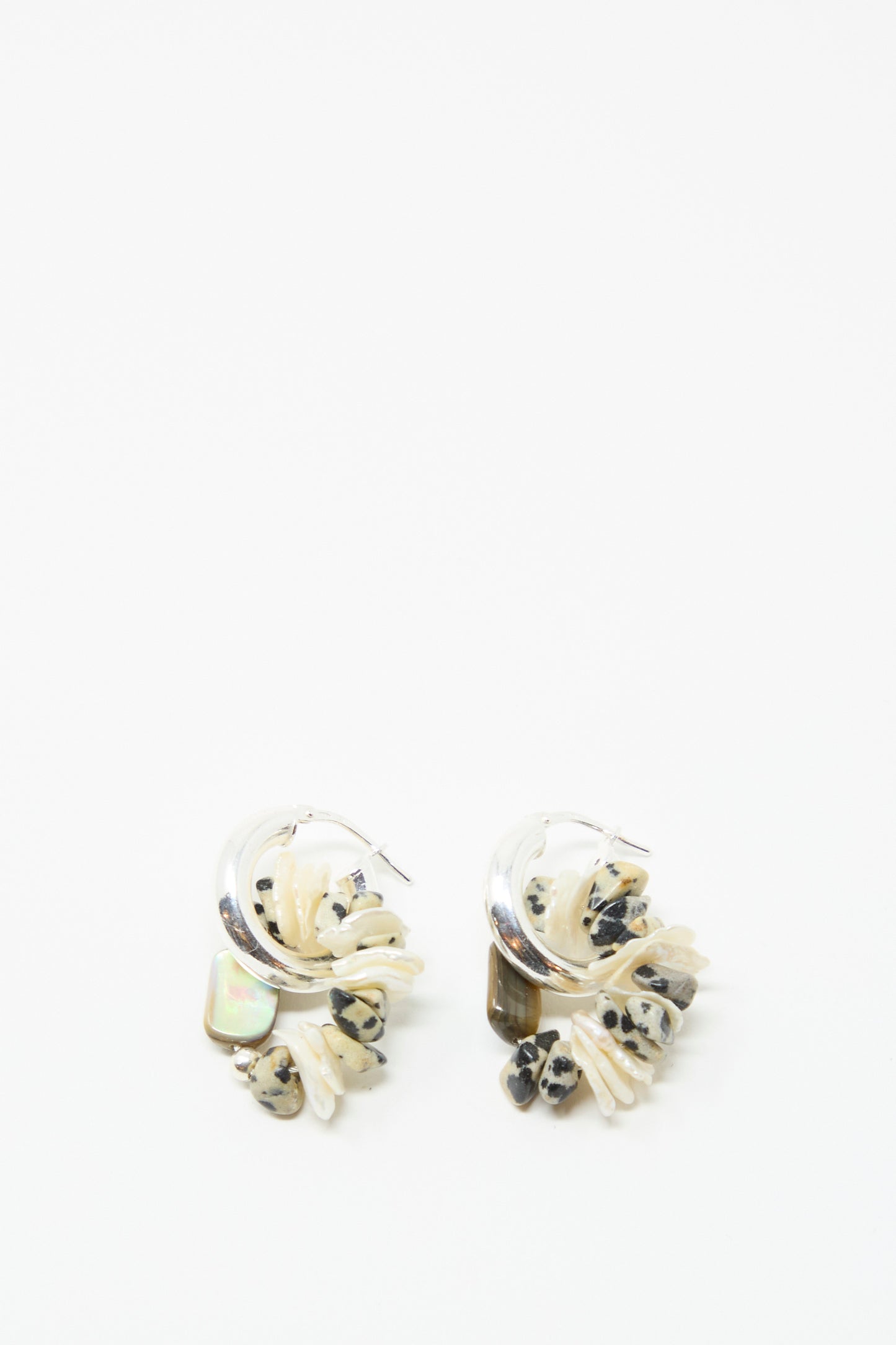 The Santangelo Che Bomba Earrings in Abalone Hoop feature sterling silver hoops with abalone and iridescent accents, shown against a white background.