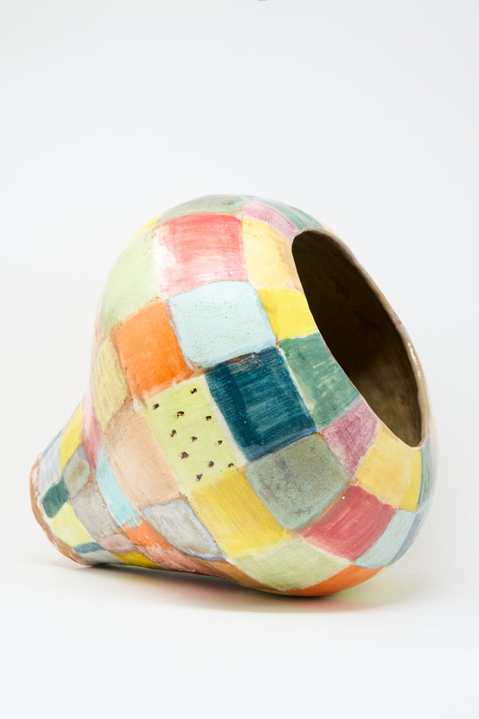 The Large Vase in Checker Multi by Shino Takeda is a hand-built, asymmetrical clay vase with a wide opening and a glossy glaze, showcasing a patchwork of pastel-colored squares.