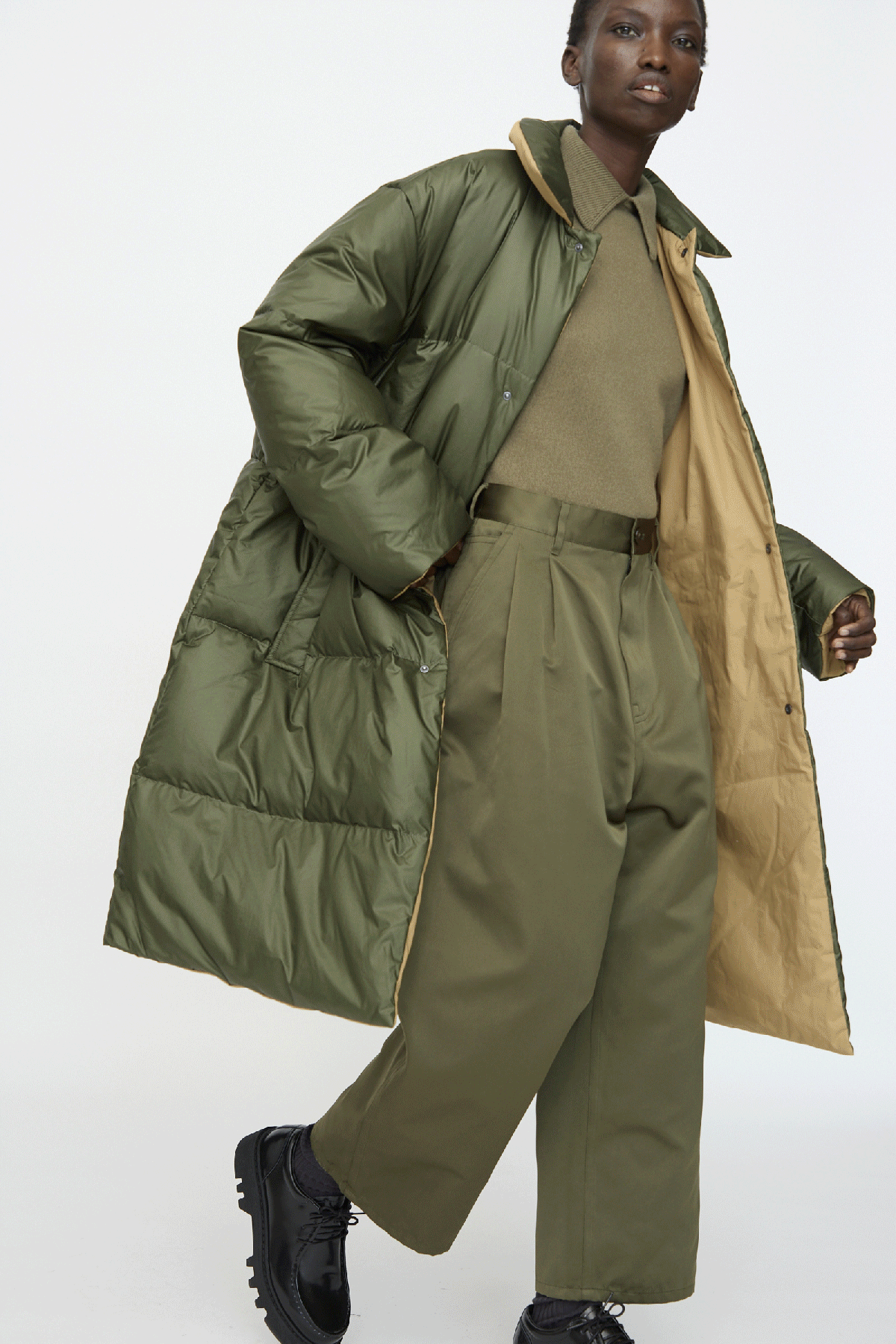 A gif of a woman wearing the Sofie D'Hoore FW25 collection against a white background.