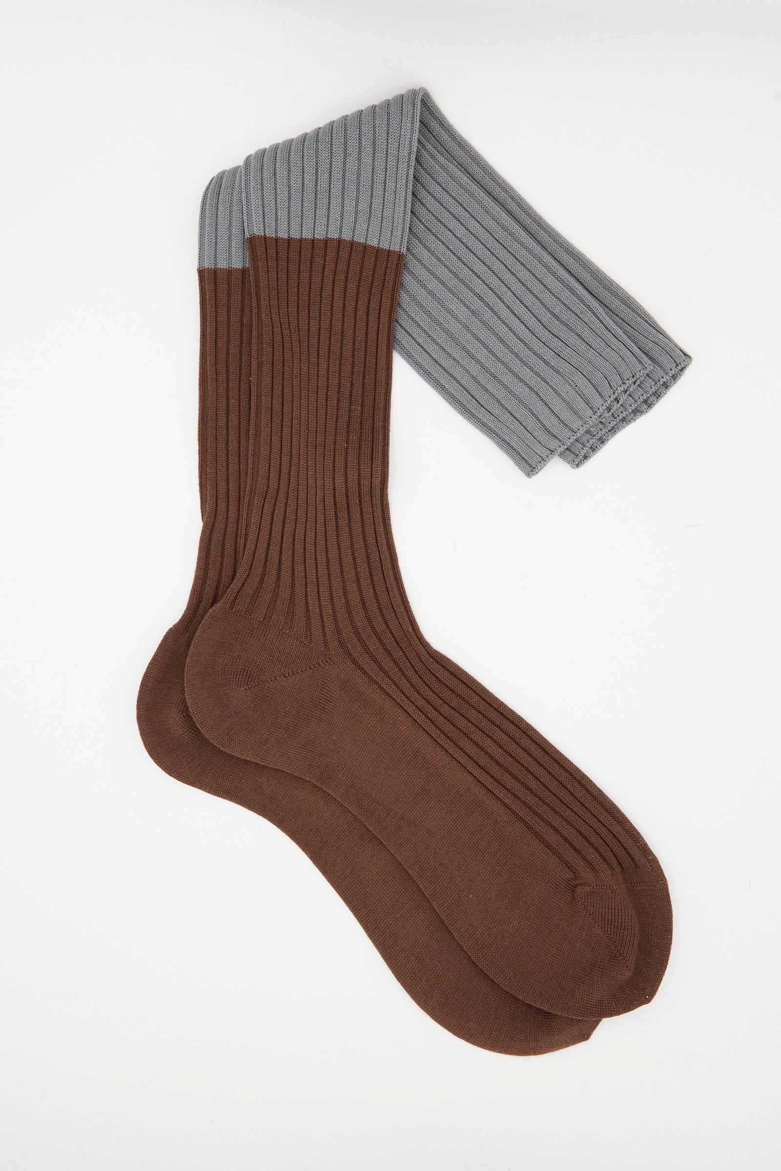 The Sofie D'Hoore Rib Friday Socks in Grey and Choco feature brown feet and lower legs with gray ribbed cuffs, crafted from soft cotton and shown on a white background.