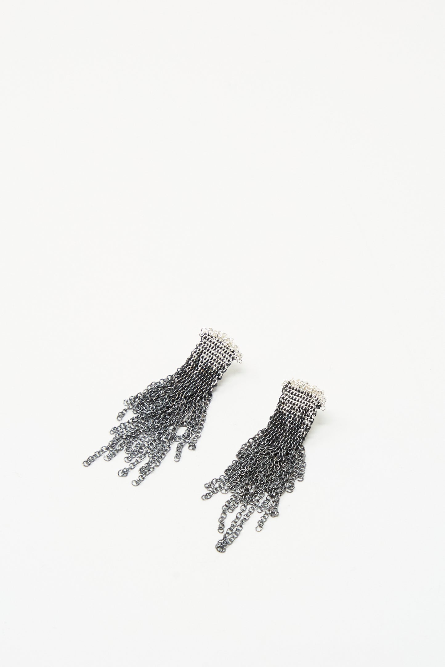 Stephanie Schneider's Sterling Silver Oxidized and Silk Earrings in Anthracite feature multiple chain strands fanned out, shown on a white background.