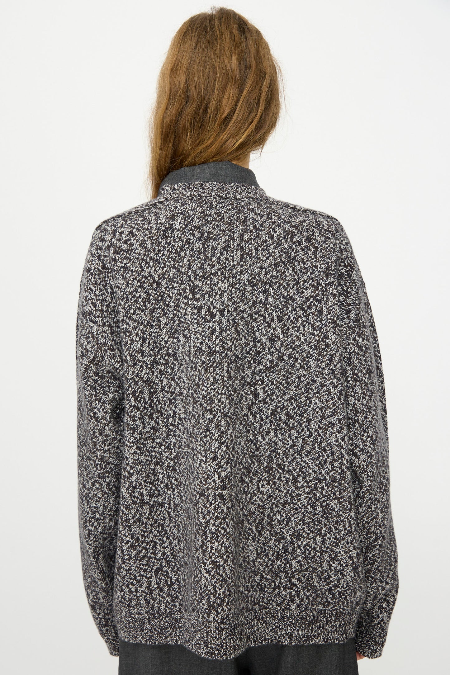 Person with long brown hair wearing the Studio Nicholson Hemyl Guernsey Jumper in Navy Mouline, photographed from the back against a plain white background.