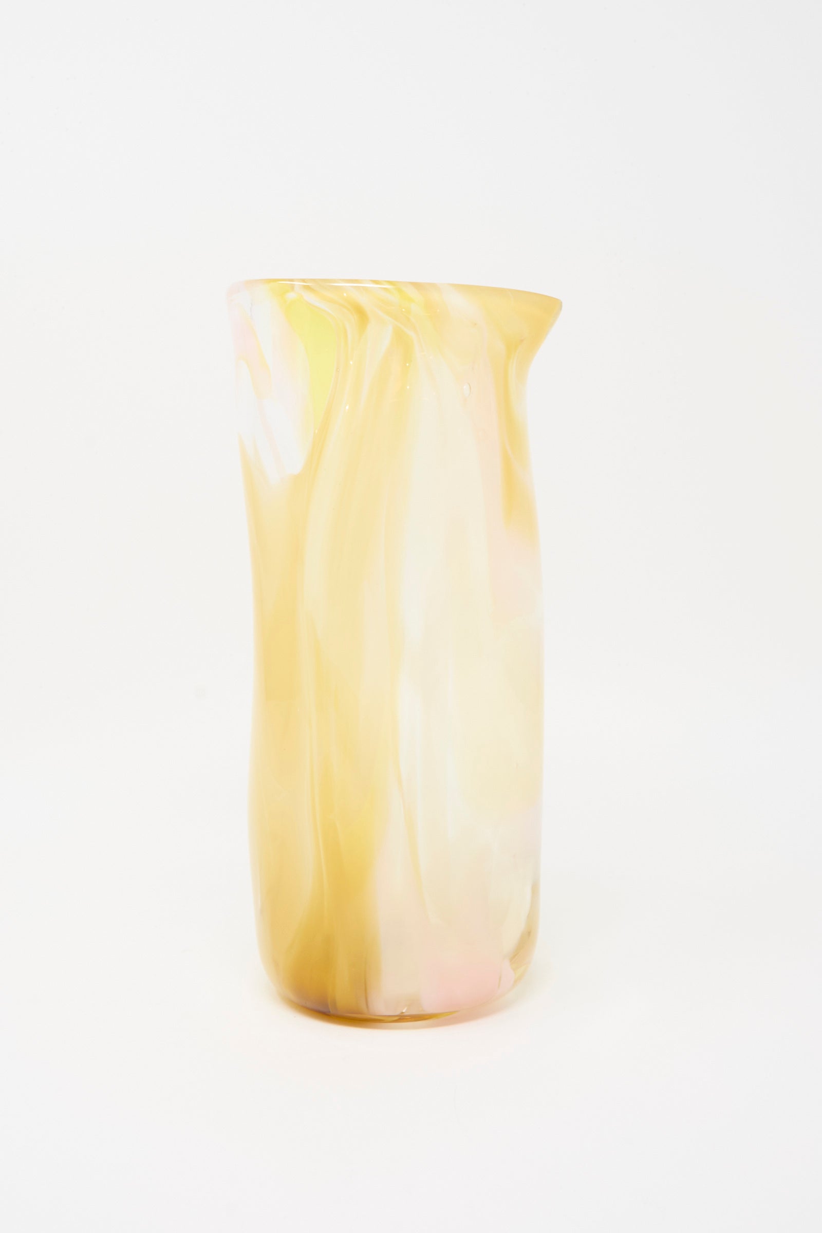 The Upstate Hand Blown Carafe in Frankie features a tall, cylindrical shape with swirled yellow and cream patterns and a small spout, made in NYC and shown against a plain white background.