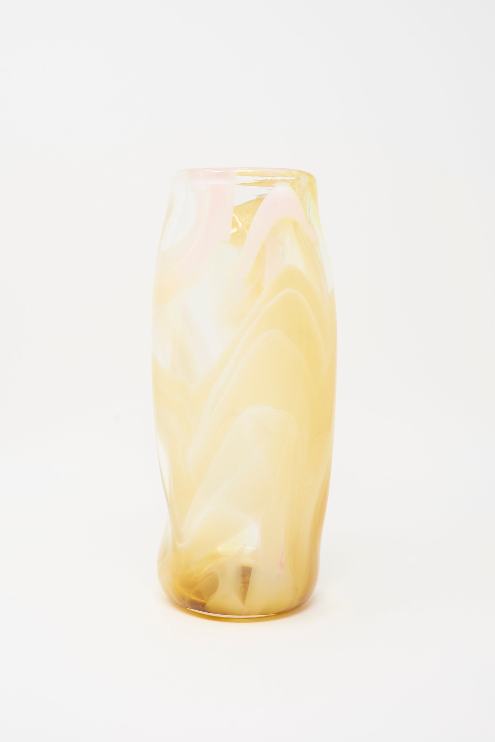 The Upstate Hand Blown Carafe in Frankie features a tall, cylindrical shape with a subtle twist and abstract swirled yellow and white patterns. Shown against a white background. Handcrafted in NYC.