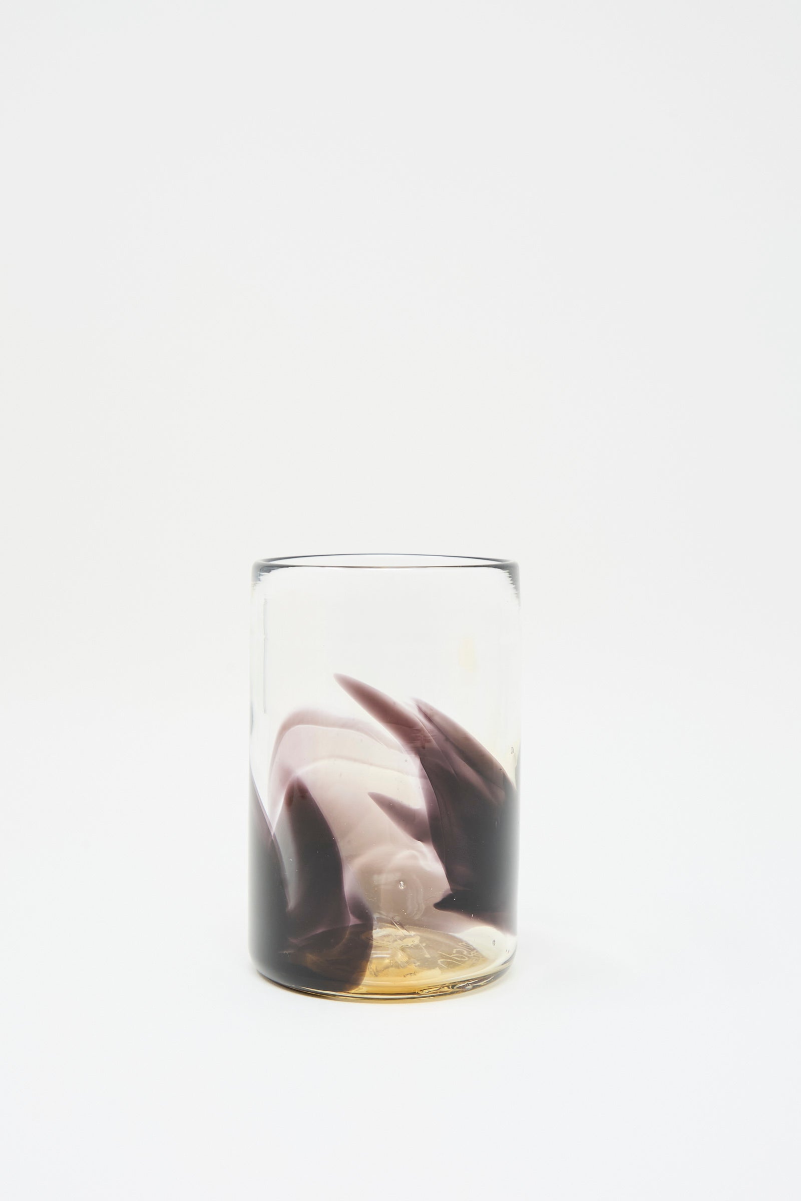 The Upstate Hand Dyed Fumé Glass features wisps of abstract color swirling inside, set against a plain white background.