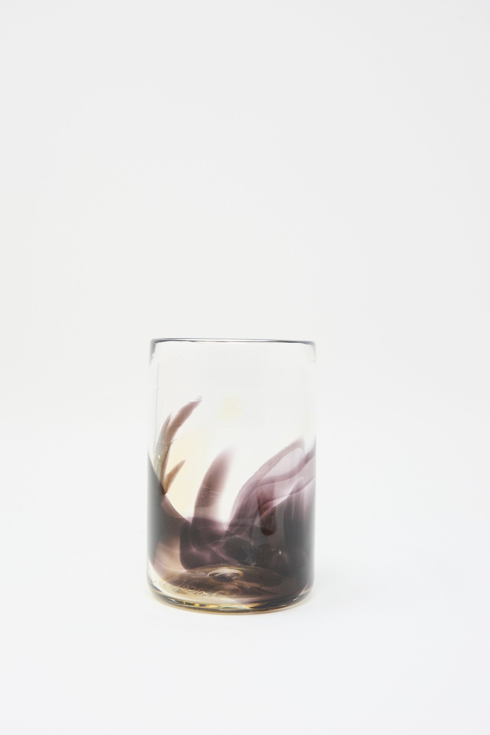 Upstate's Hand Dyed Fumé Glass, featuring dark dye swirling inside, is displayed against a plain white background.
