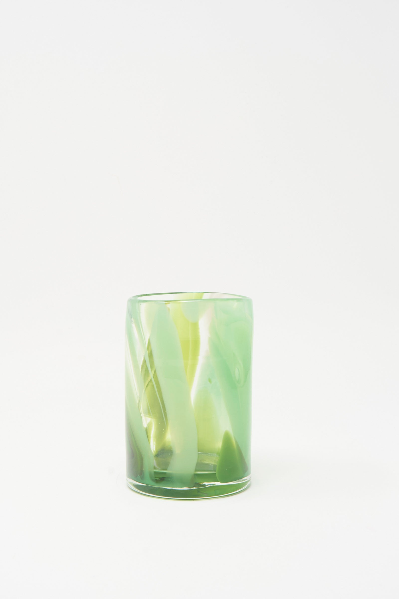The Upstate Hand Dyed Moss Glass, a green marbled, hand-blown tumbler made in NYC, is shown on a plain white background.