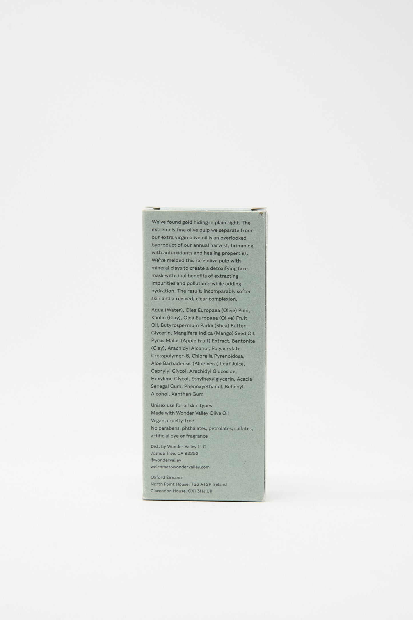 The back of the Wonder Valley Olive Mud Mask box features a light gray-green color with small black text listing ingredients and product details. This mask hydrates, balances skin, and helps prevent breakouts.