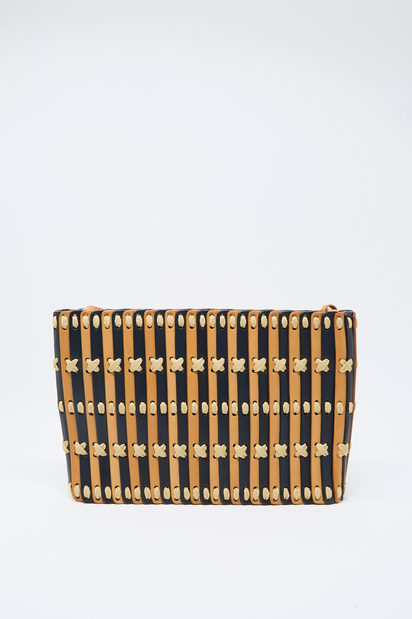 Hatori's Leather Shoulder 60 Bag in Bi-Color with Tan Lacing is a rectangular handcrafted shoulder bag, showcasing alternating vertical black and tan wooden slats connected by small tan X-shaped links. The plain white background highlights the design, which is elevated with refined accents of vegetable tanned leather.