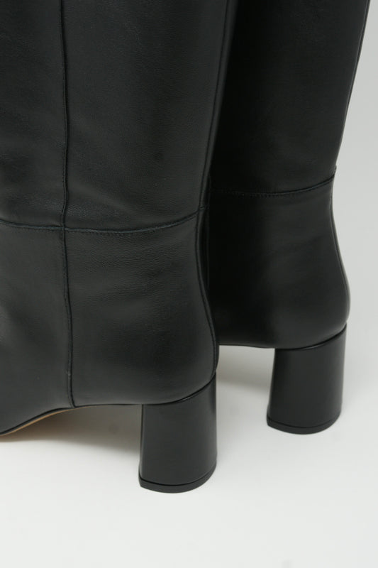 A pair of LOQ Donna Boots in Black, black leather pull-on knee high boots with a block heel, on a white surface.