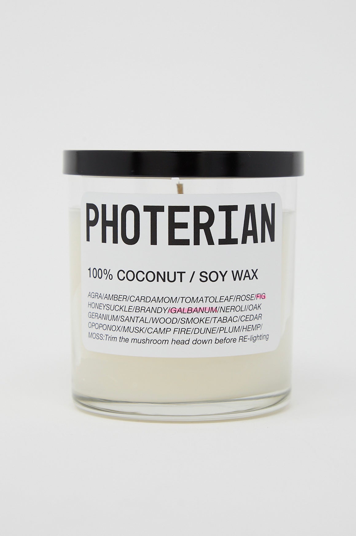 A jar with the brand name Photerian on it, containing a Votive Coconut Soy Candle in Fig.