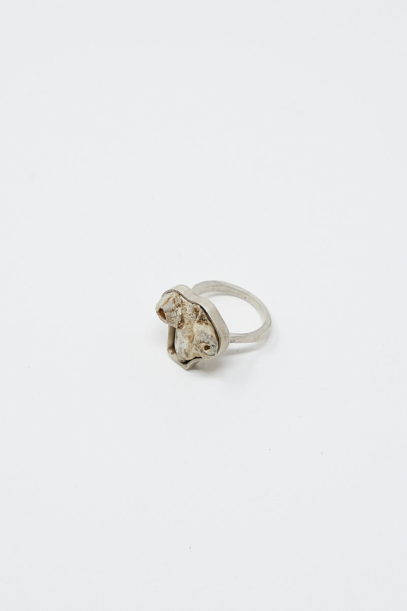 A La Ma r sterling silver ring with a diamond in the middle.