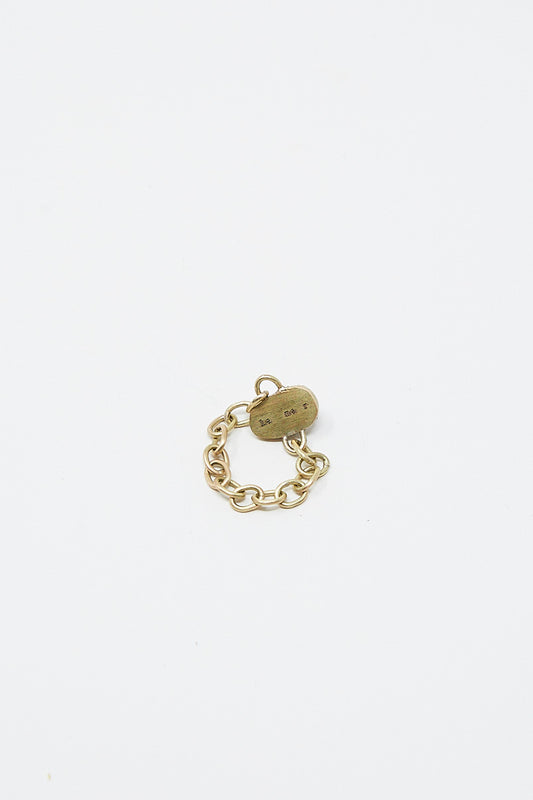A unique La Mar chain link ring with a small charm on it, made of 14K Gold Chain Link Ring 016.