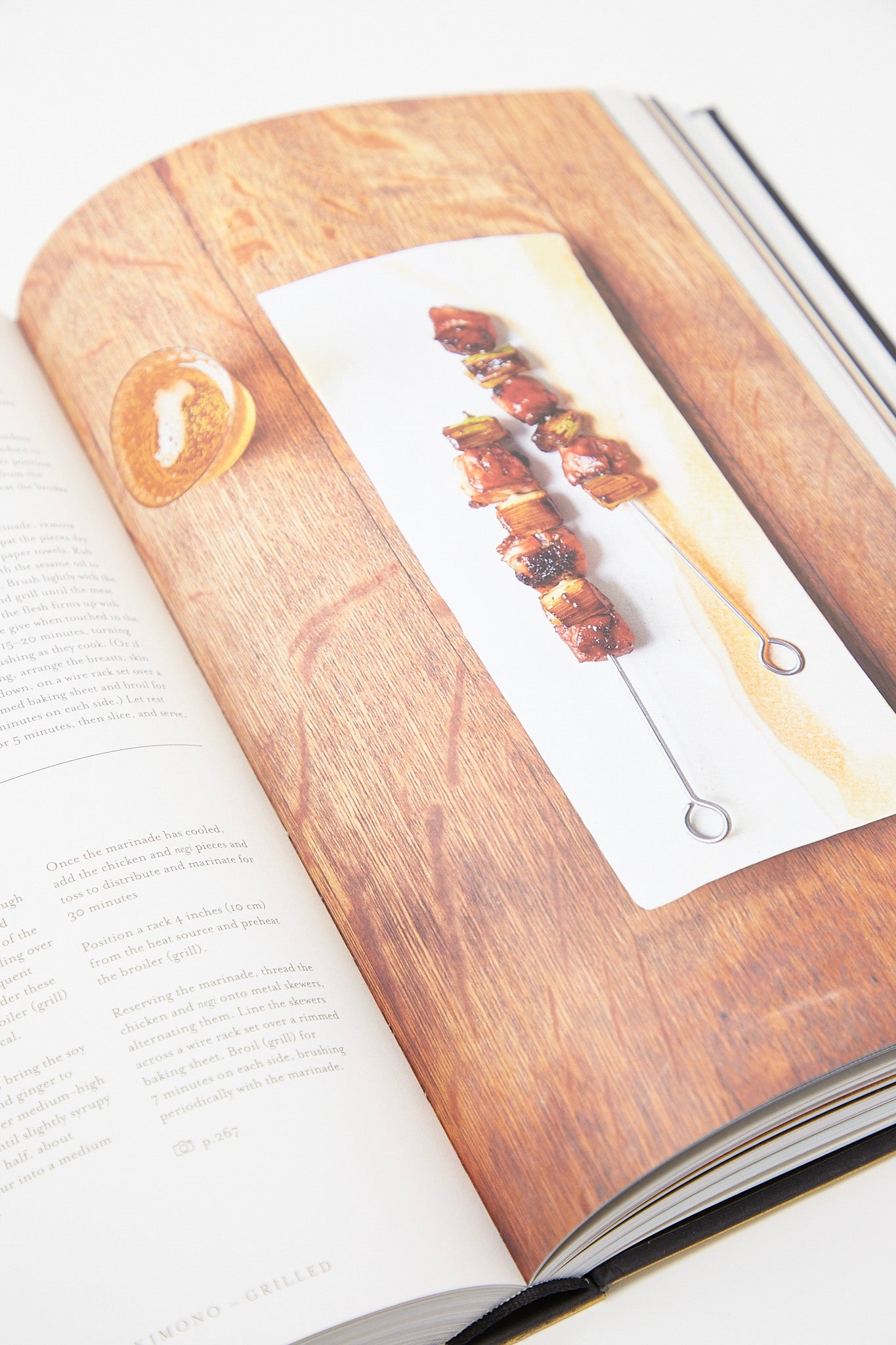 A Nancy Singleton Hachisu - Japan Cookbook by Phaidon with a picture of food on a table.