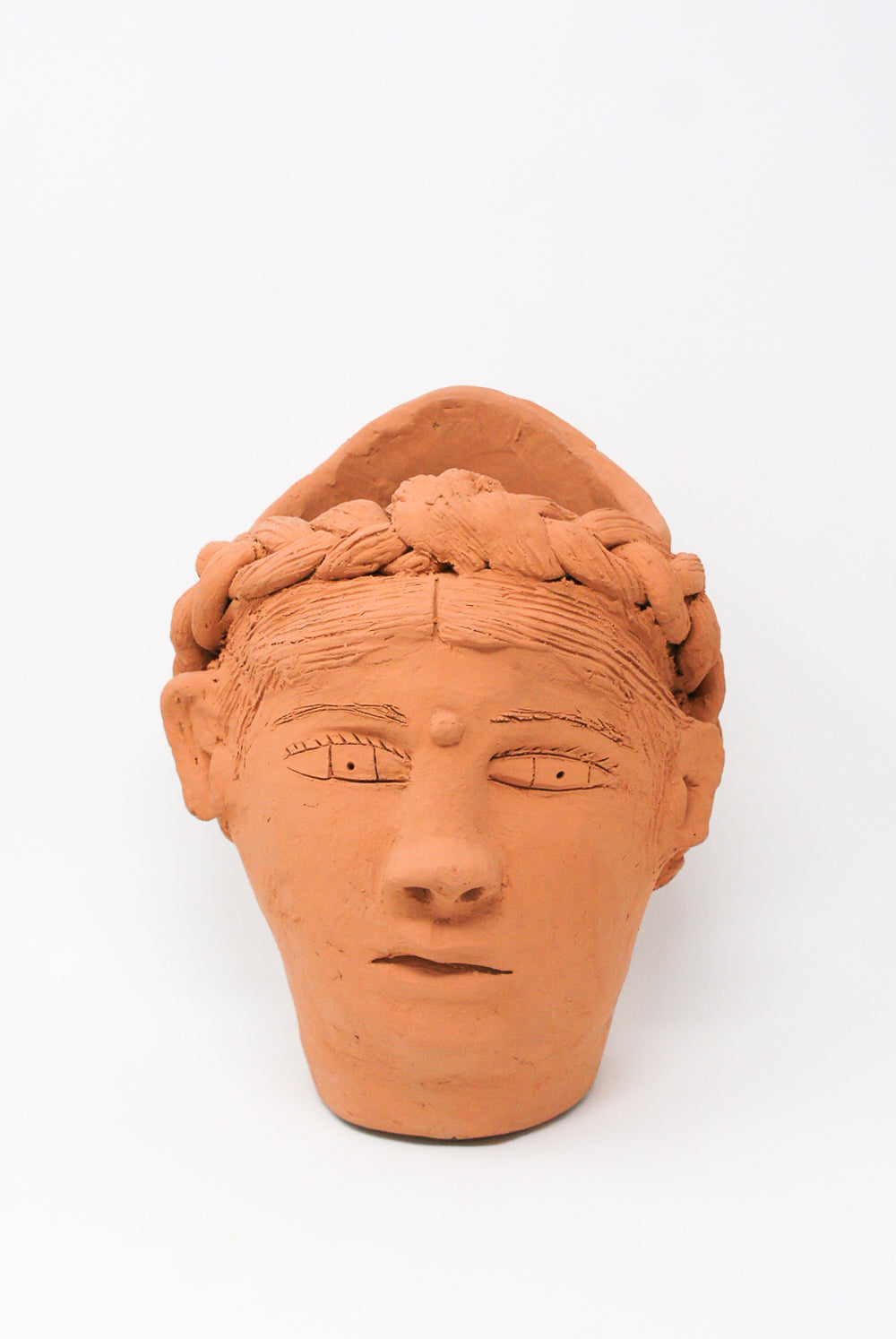 A large Head Planter in Terracotta from Oaxaca, featuring braided hair and intricate facial details by Travel Find.