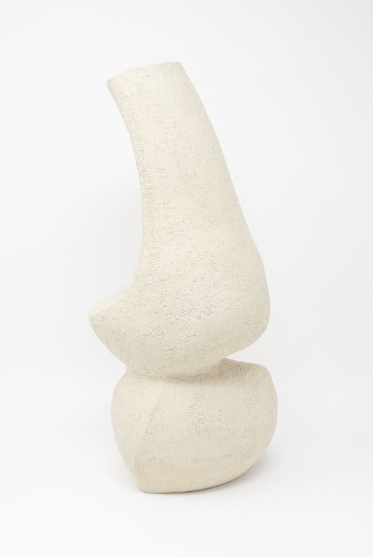 The Hand Built Vessel No. 000345 from Lost Quarry is a beige, abstract ceramic sculpture with a textured surface, featuring two stacked, rounded forms and an elongated top section reminiscent of hand-built vessels, set against a plain white background.