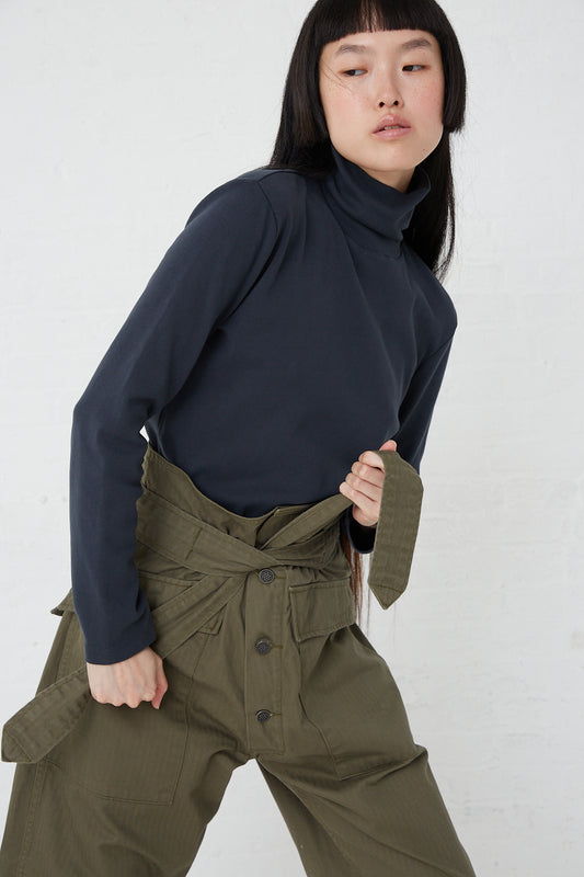 A model wearing a Tie Tanker in Olive top and olive trousers made of 100% cotton by As Ever.