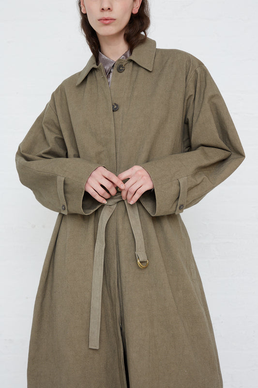 An oversized Belted Trench in Fatigue made of soft canvas with adjustable cuffs from Lauren Manoogian.