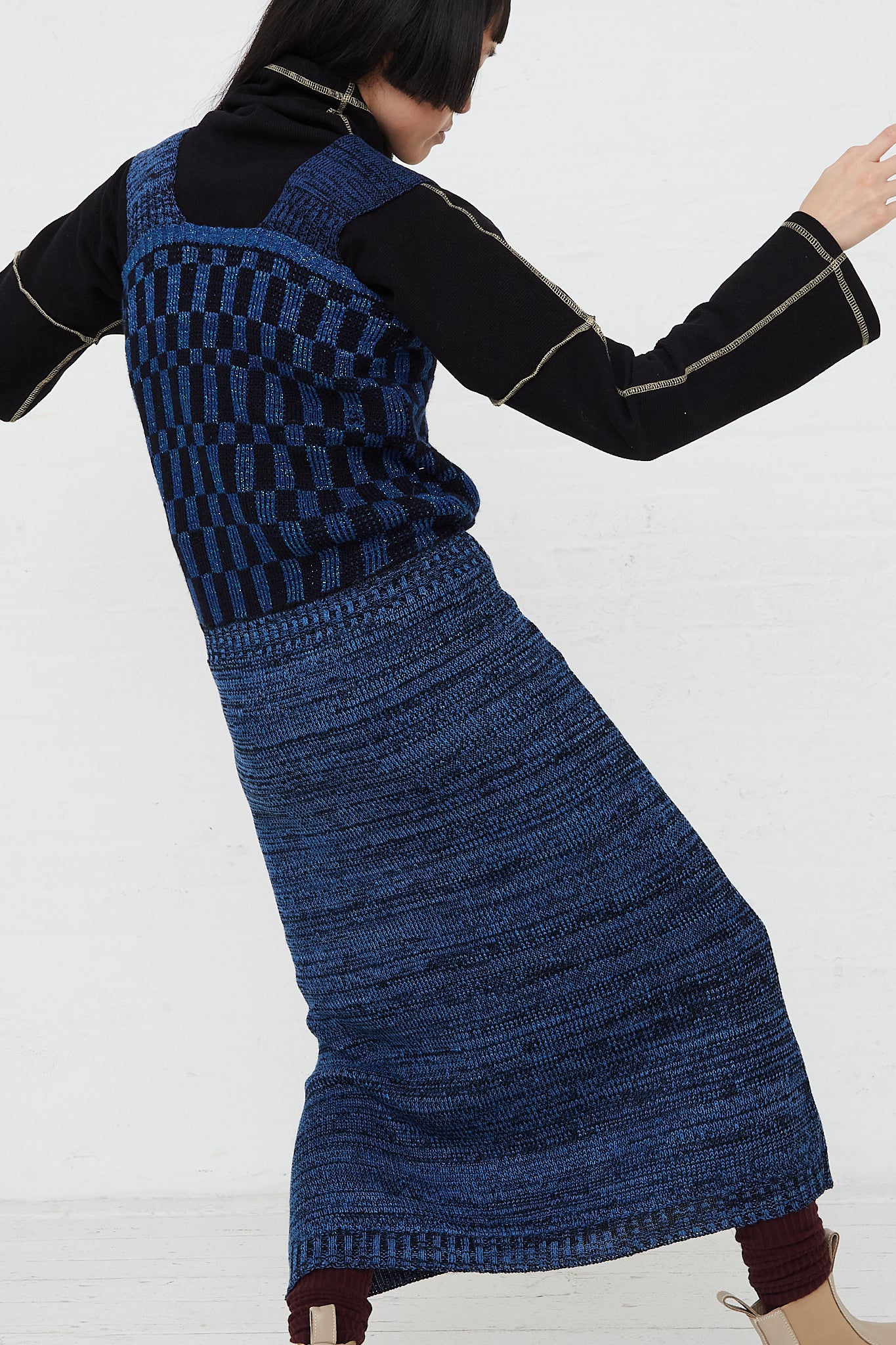 A model in an Intensity Optic Dress in Blue is dancing.