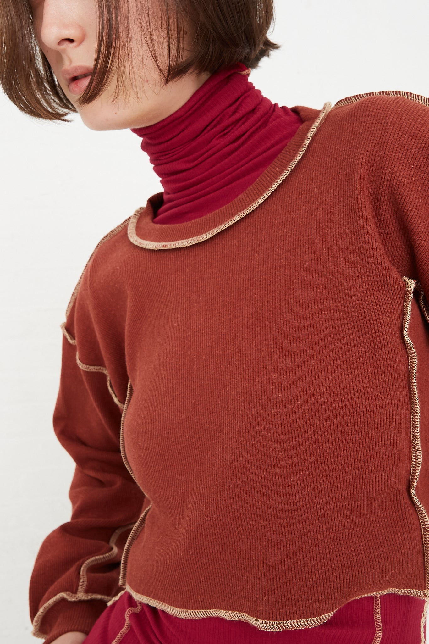 Baserange - Omato Sweatshirt in Burned Punica front neck detail